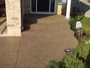 This exposed aggregate walkway has been cured and sealed with a VOC-compliant product.