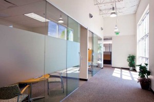 Continuous glass walls and office entrances enhance the working environment by providing opportunities to capture natural daylight. In modern construction, this is a major consideration for projects seeking certification under green building programs.