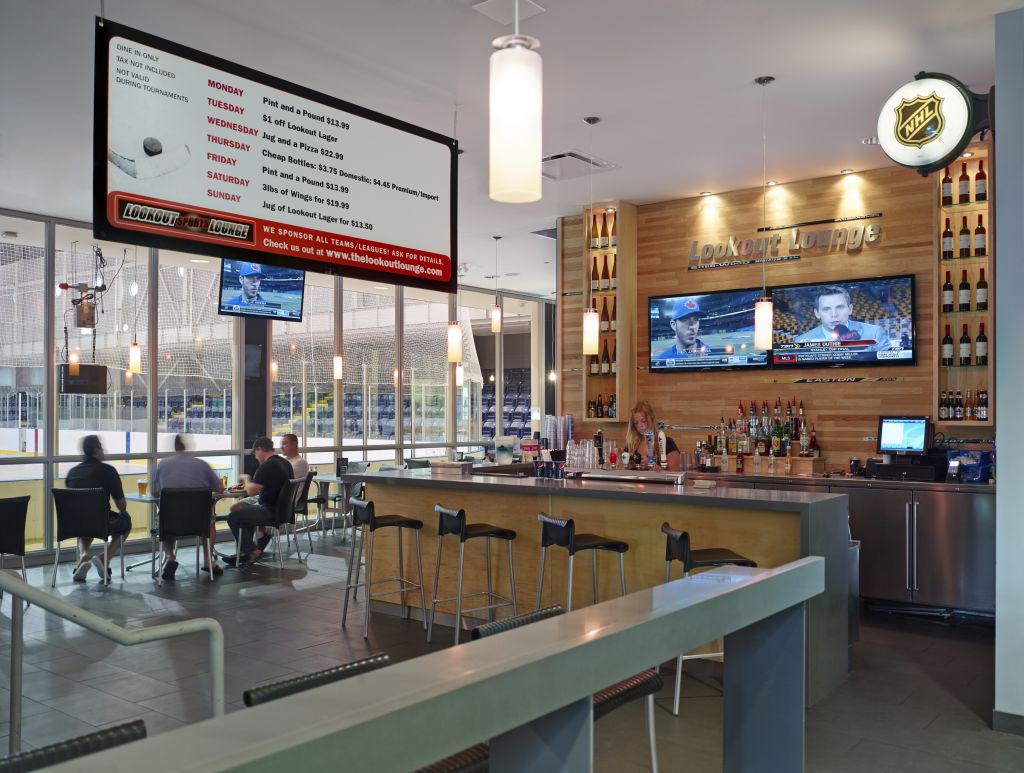 The interior of the Lookout Lounge restaurant features wood wall fi nishes at the bar.