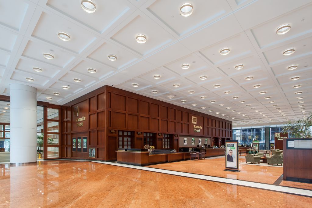 A lighting retrofit that used energy-efficient ceramic metal halide lamps gave Brookfield Place a new lease on life without having to damage or remodel the existing architecture. The new lighting system saves the property owner $60,000 annually. Photos © Scott Norsworthy