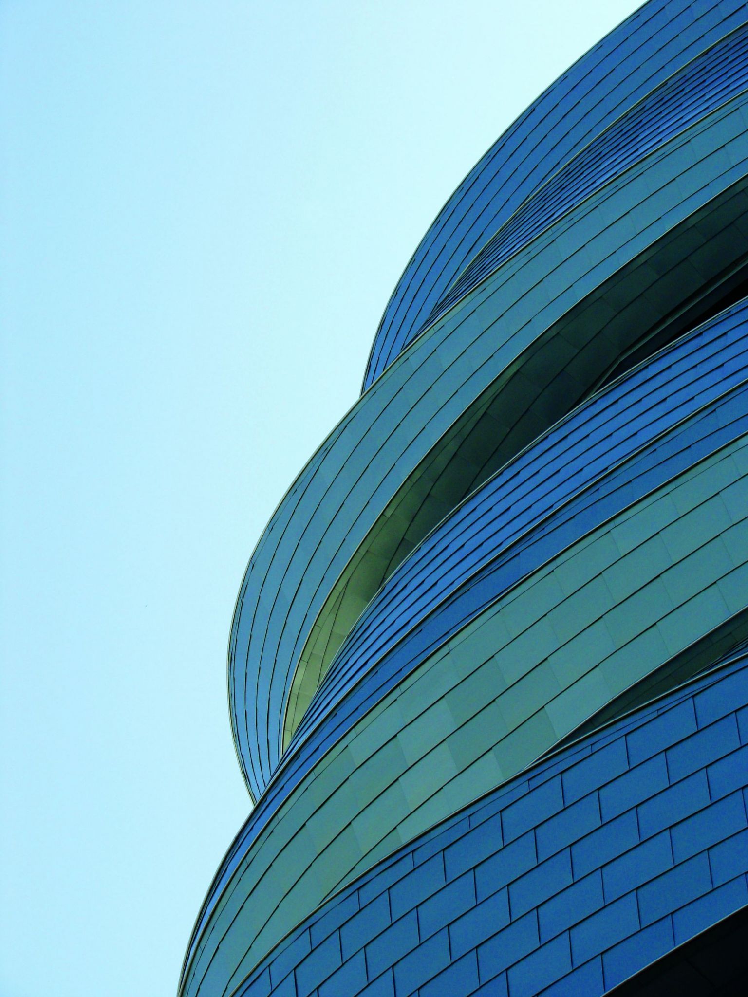 The giant metal ribbons on the air-traffi c control tower were inspired by local prairie grasses, which are sculpted by wind in summer and snowdrifts in winter. Photo courtesy Radius Track