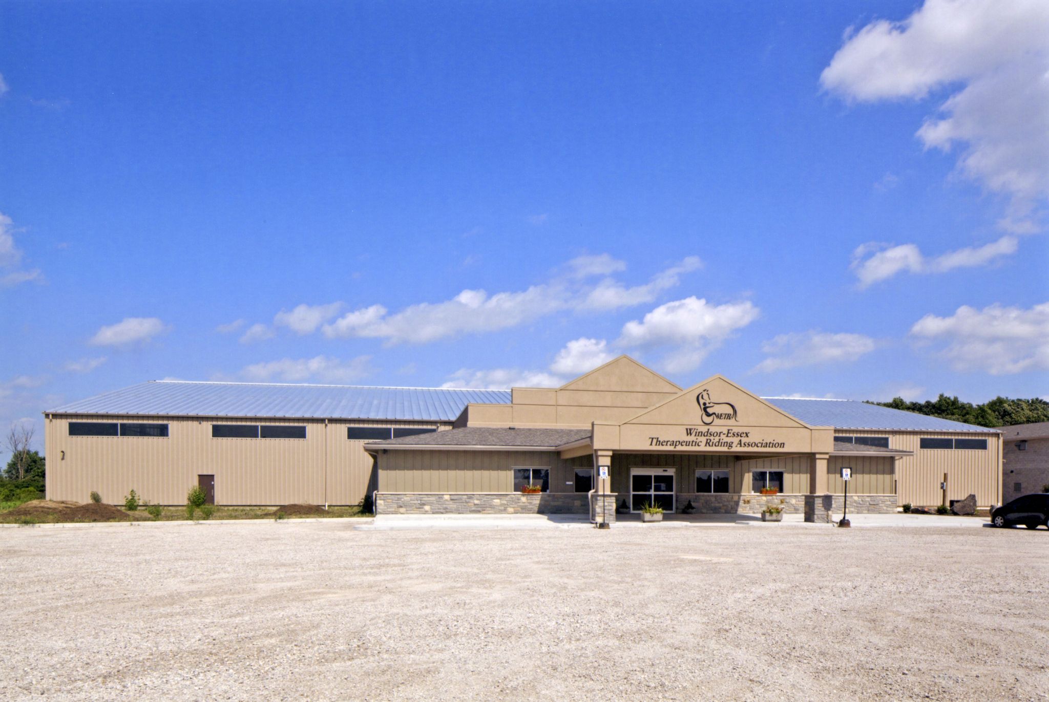 The Windsor-Essex Therapeutic Riding Association located in Essex, Ont., is a 21,367-m2 (230,000-sf) facility that provides equine-related therapy to those with disabilities. 