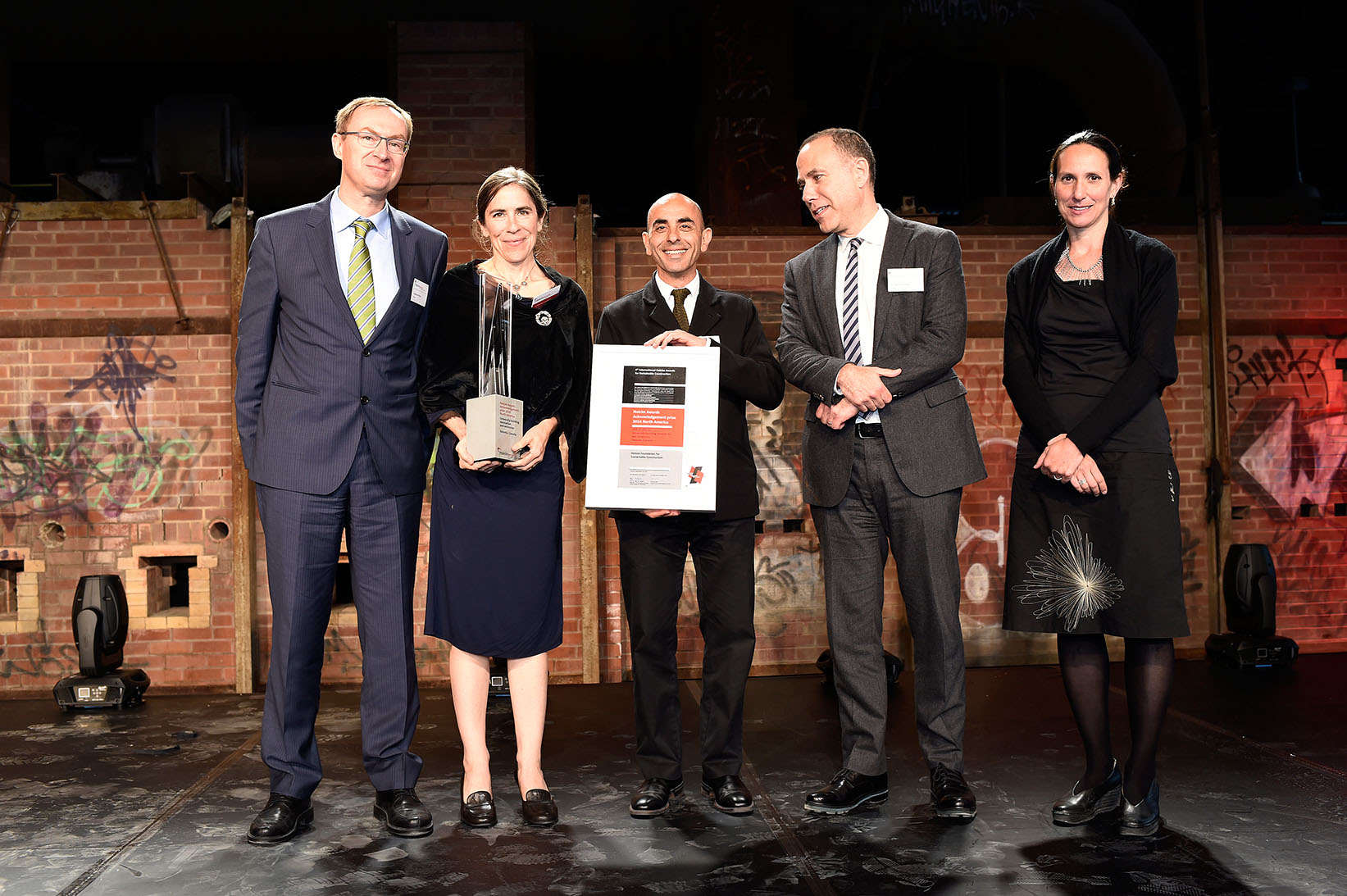 Katherine Faulkner and Nader Tehrani, of Boston’s NADAAA Architects, stand with Holcim Canada CEO Baudoin Nizet, Dean Richard Sommer of the University of Toronto’s John H. Daniels Faculty of Architecture, Landscape, and Design, and Canadian jury member Lola Sheppard (Lateral Office). 