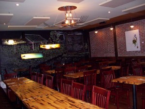 Season 2 Top Chef Canada contestant, Trevor Bird has a Vancouver restaurant, Fable, which features exposed brick walls, a creative chalkboard wall, and an open-kitchen concept. With limited wall space to make acoustic improvements, stock beige fabric clouds were hung from the ceiling.