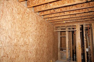 Load-bearing oriented strandboard (OSB) panelled shear walls support the engineered I-joist floor system and stand ready to assist the building in resisting any potential wind or seismic forces.