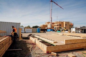 This photo shows a jobsite framing table to facilitate panellized I-joist floor section construction or the creation of the 2x6 laminated elevator shaft walls.