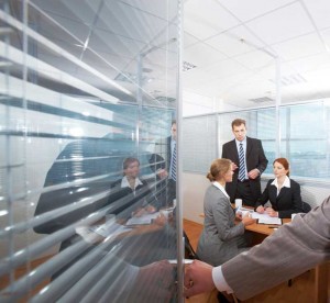 Sound-masking continues to provide acoustic control when a meeting room’s door has been opened. Photo © iStockphoto/mediaphotos 