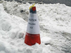 The design industry generally has very little guidance from building codes or standards when it comes to addressing ice and snow on buildings. Still, a pylon seems like a simplistic response to a real threat.