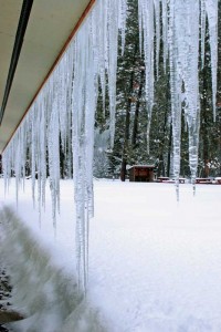 Frozen stalactites hang ominously on this low-rise building. Photo © Gregory Johnston/Dreamstime.com