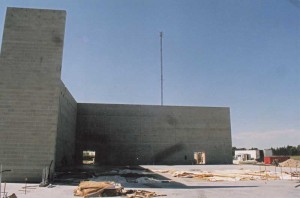 The L-shaped standalone wall is the free-standing gymnasium wall awaiting completion.