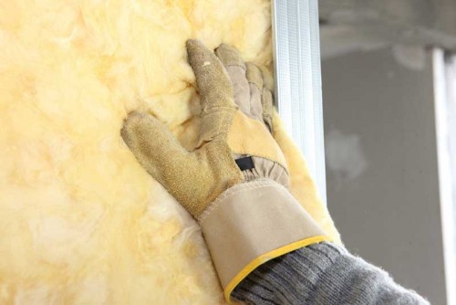 bigstock-Installation-of-insulation-12641438