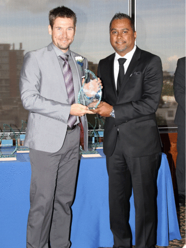 Stephen Blank, Senior Estimator at Kinetic Construction Ltd. and the VRCA’s U40 Network chairperson accepted the award on behalf of the association, presented by Nitesh Prakash of Blue Pearl Mortgage Group. Photo © Better Business Bureau Serving Mainland British Columbia