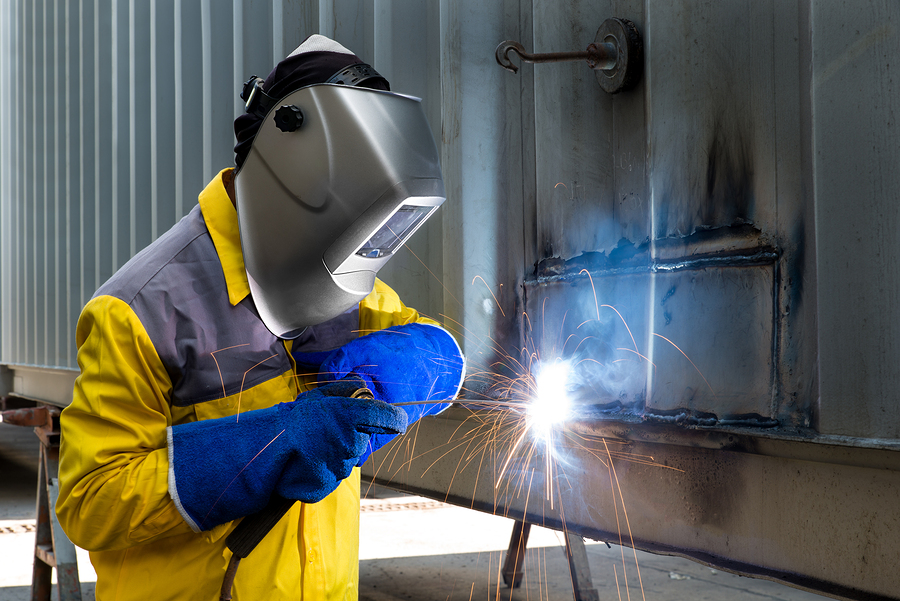 Industry Worker Welding concept - Industry worker with welding steel to repair container structures manufacture workshop.