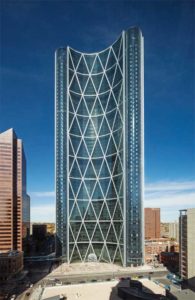 Glass is a unique material in that it has a transmitted colour and a reflected colour. What the eye sees is a blending of both the transmitted and reflected colours of the glazing. Shown is The Bow, an office building in Calgary. Photo © Tom Kessler Photography  