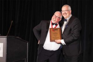 President-elect Paul Gerber presents outgoing CSC president David Boyle, CTR, with a plaque in recognition of his term as president.