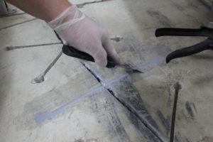 A carbon fibre overlay stops cracks by locking in both sides of a crack, preventing further movement. It is designed to structurally repair cracks in concrete floors, decks, and foundations. Installation can be completed in minutes using only a diamond blade and drill. The ultra-thin profile uses less epoxy, making it cost effective and less intrusive.