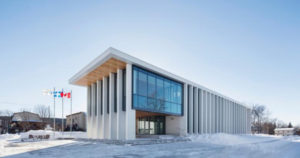 Rigaud City Hall, a new civic administration facility for a small Québec community, connects existing public amenities with new facilities, and redevelops several vacant lots. Photo © Adrien Williams