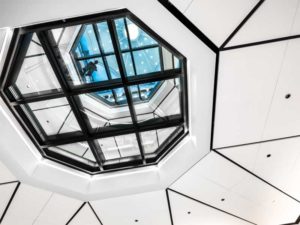 In a renovated courthouse, a set of fire-rated glass floor systems connect the lower floors to the dramatic upper domed space. Photos courtesy Technical Glass Products