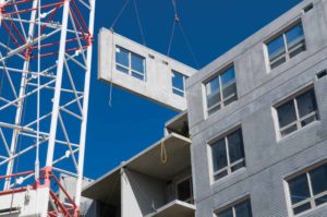 Installation of precast concrete wall panels.