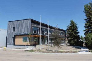 The main exterior finish of Alberta’s Valleyview Town Hall is phenolic panel siding on the visible south and east elevations and prefinished metal siding on the north elevation. The south elevation is shown here.