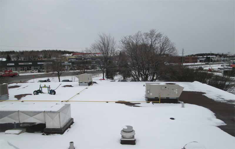 A snow-covered roof poses significant challenges, especially with rooftop mechanical equipment.