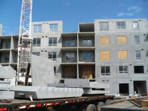 Construction using precast concrete elements.