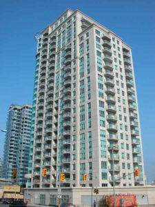 The visual juxtaposition of blue-green glass and limestone-coloured façade on the two 25-storey buildings at Claridge Plaza, Ottawa, add an imposing feature to the city’s skyline. Photo courtesy CPCI