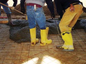 Workers in this photo are walking down welded wire reinforcement (WWR) because the wire spacings are too small.