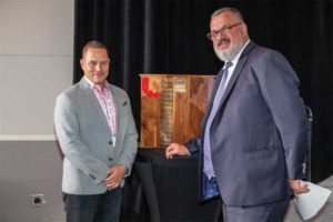 CSC executive director Nick Franjic, CAE, congratulates Trevor Devnich, Calgary Chapter chair, on receiving the Lloyd Boddy Chapter of the Year Award.