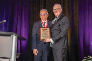 CSC president Paul Gerber (right) presents Brian Colgan, FCSC, RSW, with a CSC Life Award.