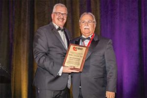 CSC president Paul Gerber (left) presents Michael Schneider, FCSC, CCCA, with a CSC Life Award.