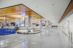 The international terminal at the Calgary airport is an 185,000-m2 (2 million-sf) open-space structure with complicated sound control challenges. Multiple materials helped serve the variable acoustic needs while creating sleek design touches.