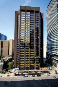 Figure 5: This image shows the installation of glazing systems on a high-rise using a drop-by-drop approach.