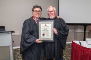 CSC College of Fellows Chancellor Mike Garlinski, FCSC, (left) welcomes David Boyle, CTR, into the College.