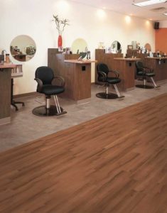 Flooring can separate spaces for different purposes, such as this luxury vinyl tile (LVT) demarcating where it is safe to walk and areas needing more privacy.