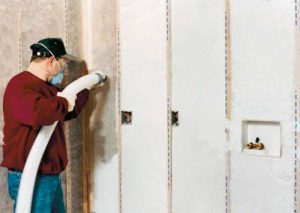 Installation of a blow-in insulation system.