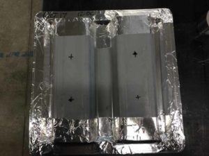 Sample of metal deck for ASTM E96 vapour permeability testing in a conditioned lab.