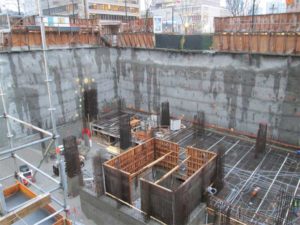 Telus Gardens in Vancouver used 1600 m³ (56,503 cf) of concrete treated with a crystalline admixture to waterproof all six levels of below-grade parking. External membranes could not be used due to the inherent risk of tearing. Further, petroleum-based externally applied membranes were ruled out as the project team was working toward a Leadership in Energy and Environmental Design (LEED) designation.