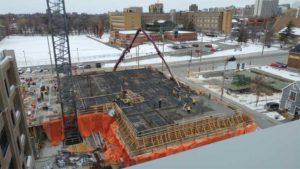 Aerial shot of activity on a jobsite during winter construction. 