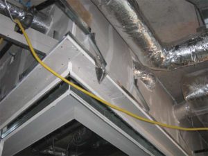 Figure 1: Duct interference with the wall. Photos courtesy Aercoustics