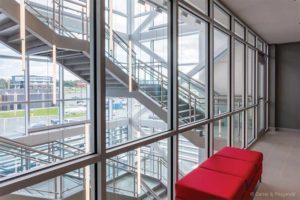 The fire-resistive glass in KMK Place, St. John’s, N.L., allows light to filter deep into interior spaces, while still meeting fire codes. Photo © Carter & Fitzgerald