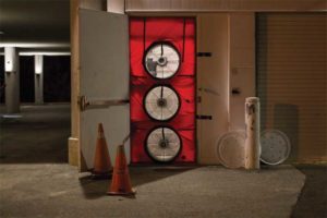 Prep work for air leakage tests includes the placement of blower door fans to keep the pressure uniform throughout the building. Images courtesy CoEfficient Building Science