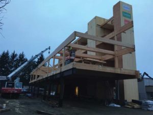 The shear walls and floor panels of the Charter building are cross-laminated timber (CLT), fit into a glue-laminated (glulam) skeleton.