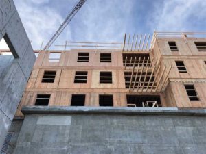 Above the fire hall, the residential floors of the building are of light wood-frame construction. Photo © Johnston Davidson Architecture