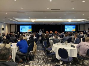 A picture from the Alberta Energy Efficiency + Innovation Summit where the partnership between Alberta Ecotrust Foundation and Efficiency Capital was announced.