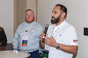 CSC president Kaz Kanani, FCSC, CSP, CCCA, along with Calgary chapter director, Jonathon Greenland, CTR, give attendees a warm welcome during the opening reception.