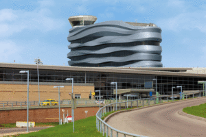 The LEED gold-certified, Edmonton International Airport combined office tower features a curved, ribbon-like exterior manufactured with architectural zinc.