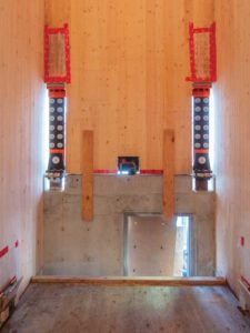 Seismic dampers used in the cross-laminated timber (CLT) walls of the elevator and stair shafts.