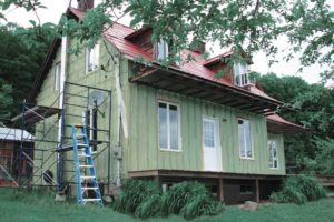 A house built in 1907 was retrofitted with hydrofluoroolefins-blown (HFO-blown) spray foam insulation.