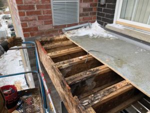 A wooden balcony suffering from effects of rain and rot. Photos courtesy Edison Engineer Inc. 